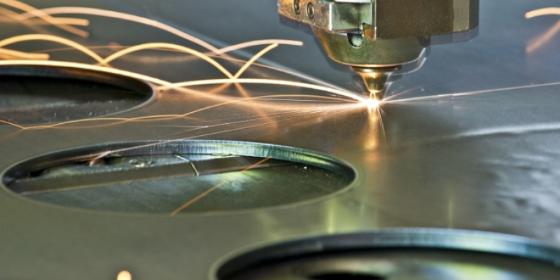 Laser cutting example during contract manufacturing process of precision machined parts.